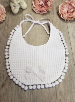 Bavoir pompon
